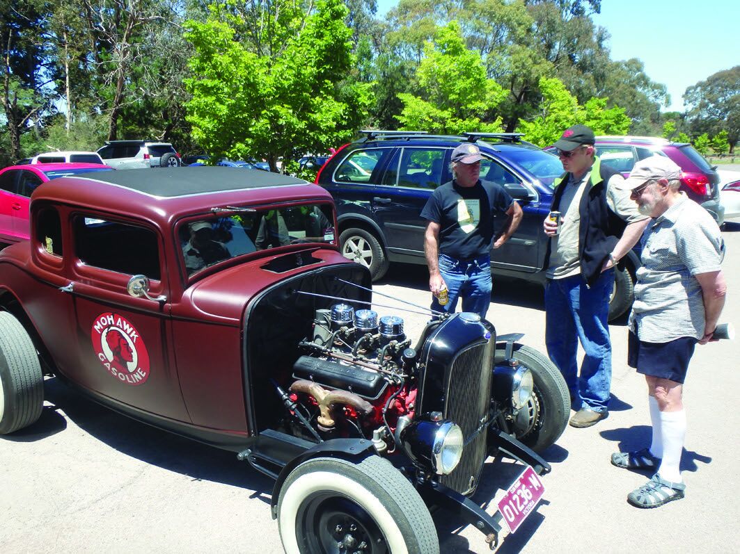 Two Daves admire our Club Captain's new hot rod at the BBQ